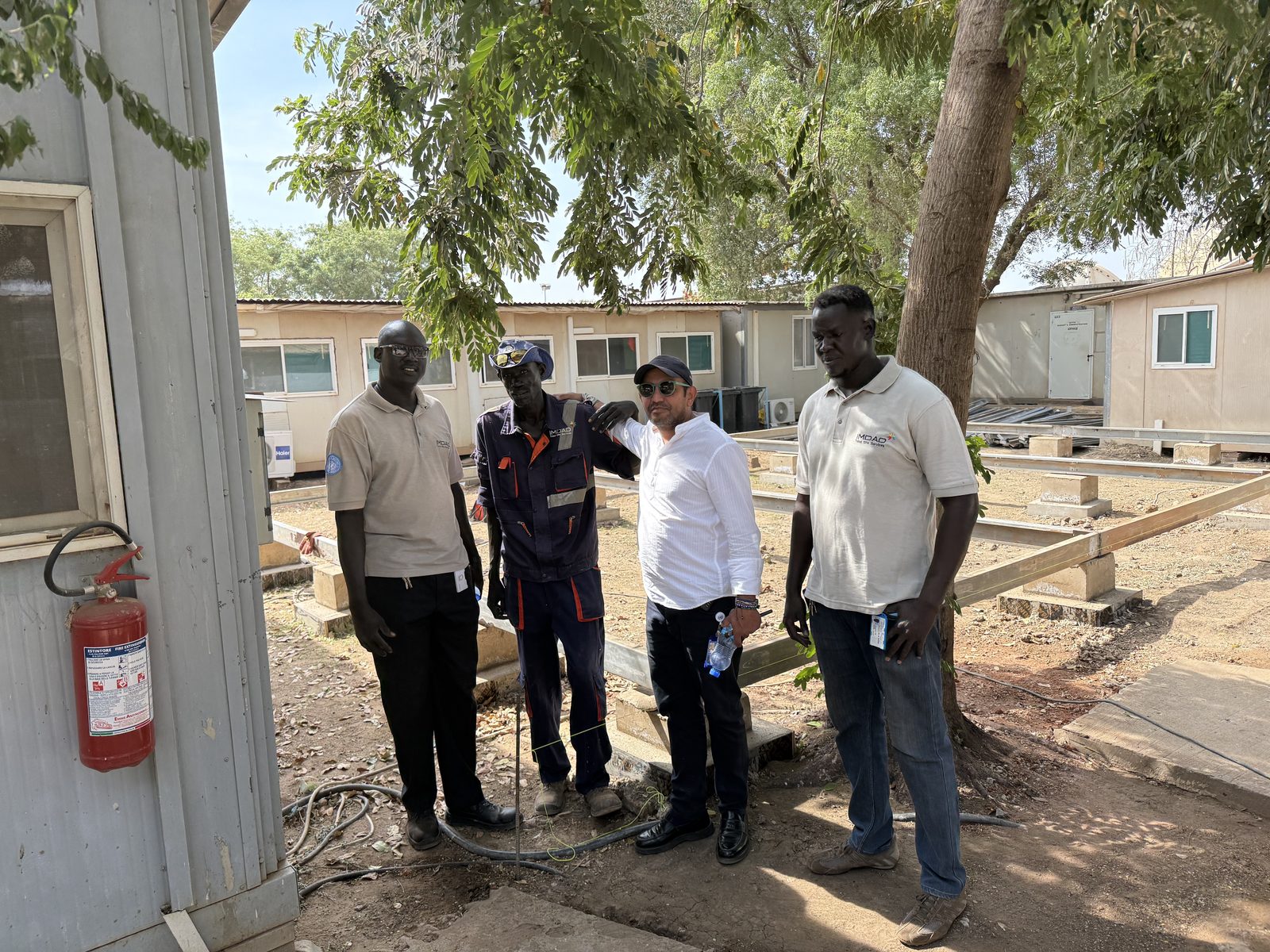 Ibrahim AlSafadi with IMDAD employees at the UNISFA Abyei camp